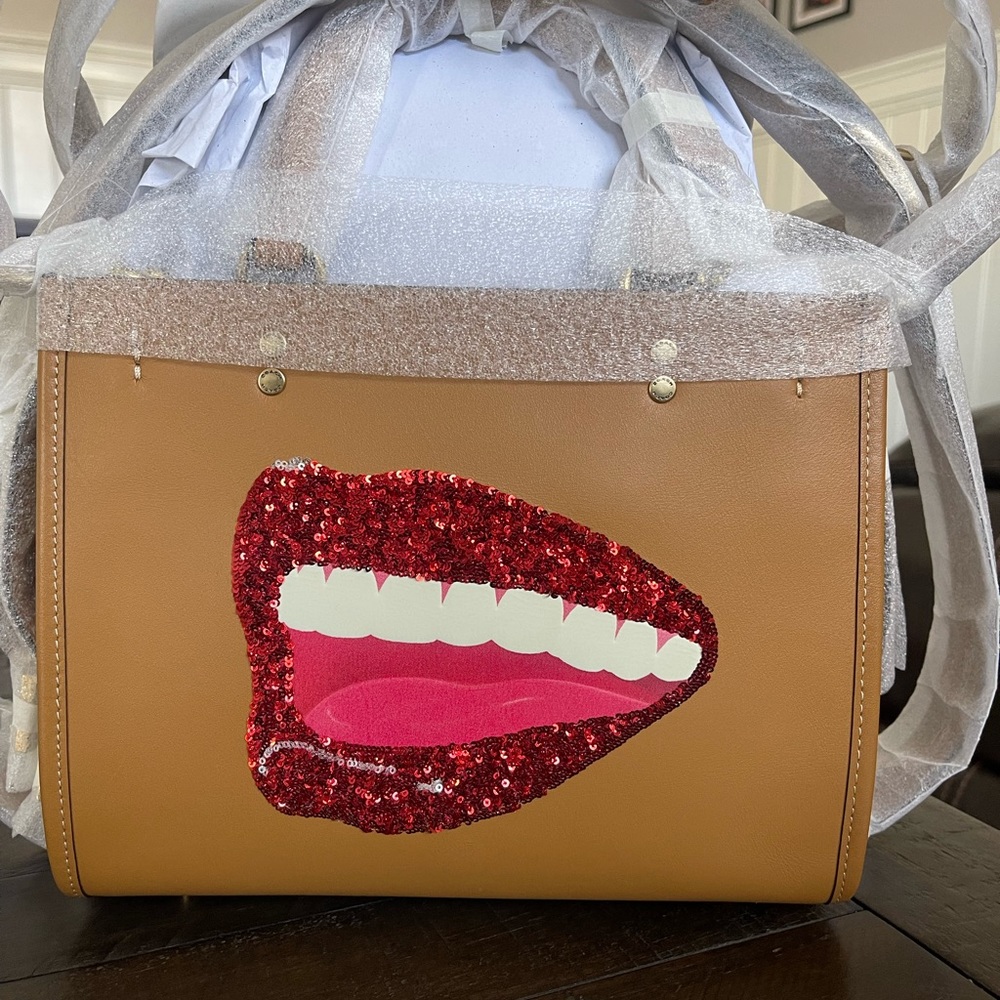 Brand new never used Coach rogue 25